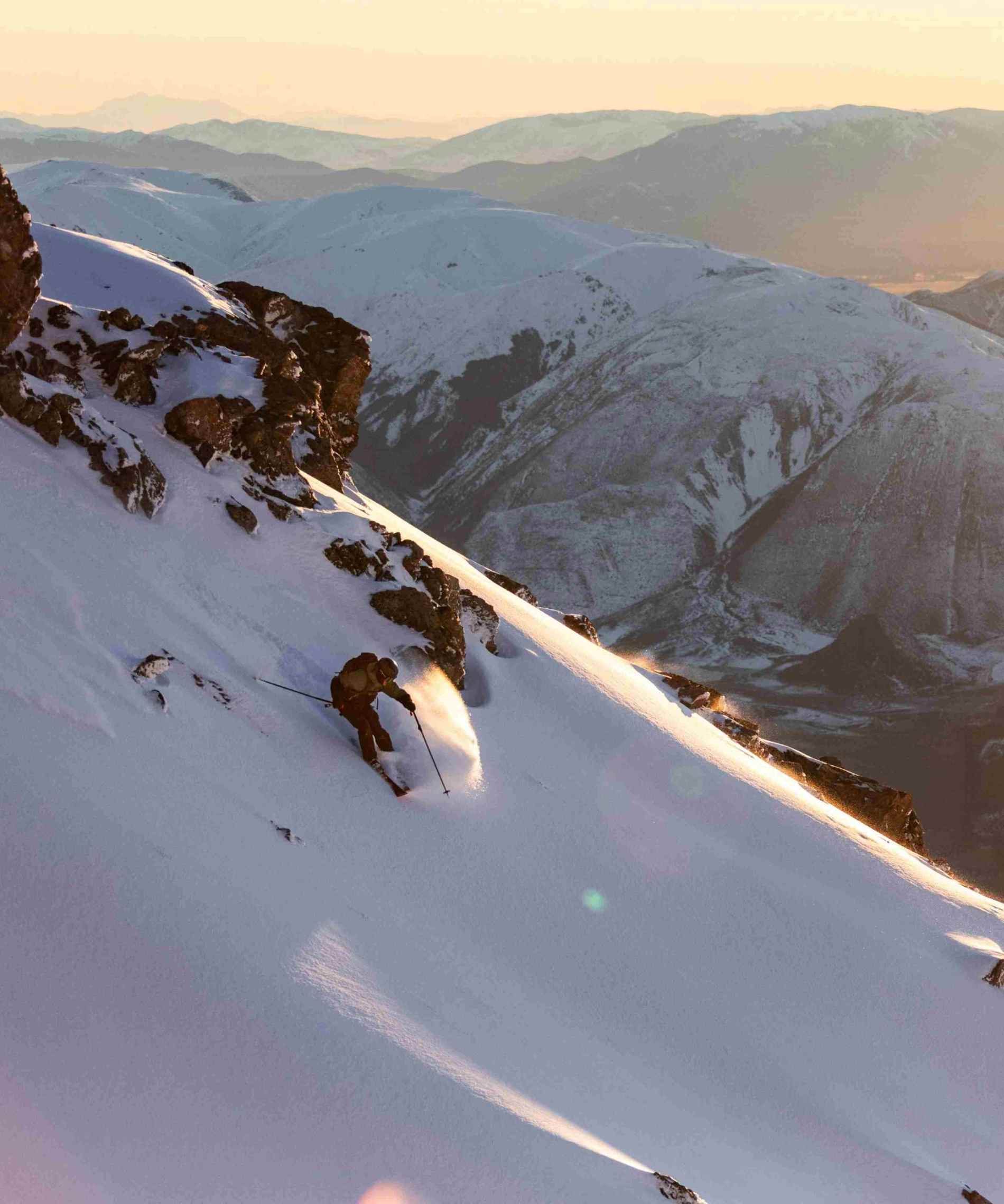 Skier in Mt Hutt backcountry with wide alpine views at sunrise